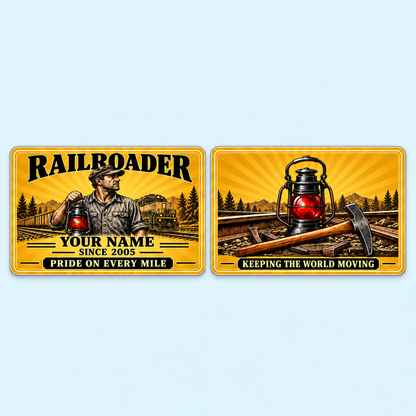 Railroader Golden Milestone aluminum keepsake wallet card, front and reverse views. Golden sunburst artwork frames a railroad worker carrying a signal lantern, with bold name-and-year lettering below. The matching reverse features railroad tools and KEEPING THE WORLD MOVING, offering a warm tribute to years on the rails.
