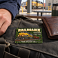 Railroader Rugged Field wallet card on a canvas gear bag beside a leather wallet in a depot crew rest area.