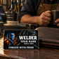 Welder Midnight Pride wallet card beside a brown wallet during a coffee break
