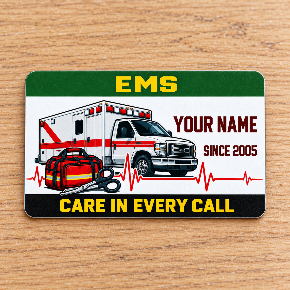 EMS aluminum wallet card with green and yellow bands on pale oak