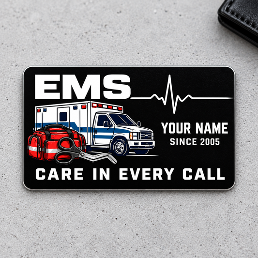 EMS aluminum wallet card with midnight black design on gray concrete