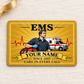 Golden EMS aluminum wallet card on cream linen with gift ribbon