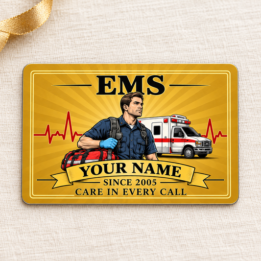 Golden EMS aluminum wallet card on cream linen with gift ribbon