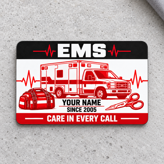 Red Monochrome EMS aluminum wallet card on light-gray concrete