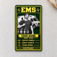 Portrait Trade Legend EMS aluminum wallet card on pale cream concrete