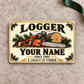 Logger Ivory Heritage aluminum wallet card front on stone with green gift ribbon.