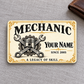 Front of Mechanic Ivory Heritage aluminum wallet card on gray linen with a closed wallet.