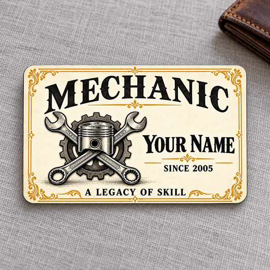 Front of Mechanic Ivory Heritage aluminum wallet card on gray linen with a closed wallet.