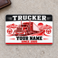 Trucker Red Monochrome aluminum wallet card front on warm gray concrete
