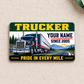 Front of Trucker Green Band aluminum wallet card on cream linen