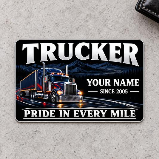 Front of Trucker Midnight Pride aluminum wallet card on pale gray concrete