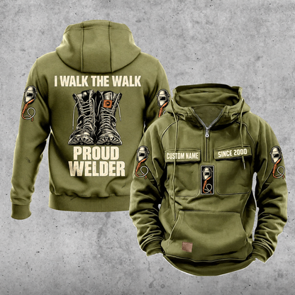 Welder Proud Walk Vintage Hoodie in Military Green, front and back views with sample text CUSTOM NAME and SINCE 2000, work-boot back illustration, and welding helmet and torch motifs.