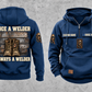 Welder Once and Always Vintage Hoodie in Dark Blue, separate front and back views with sample chest text CUSTOM NAME and SINCE 2000, welding helmet motifs, and boots against stacked steel artwork.